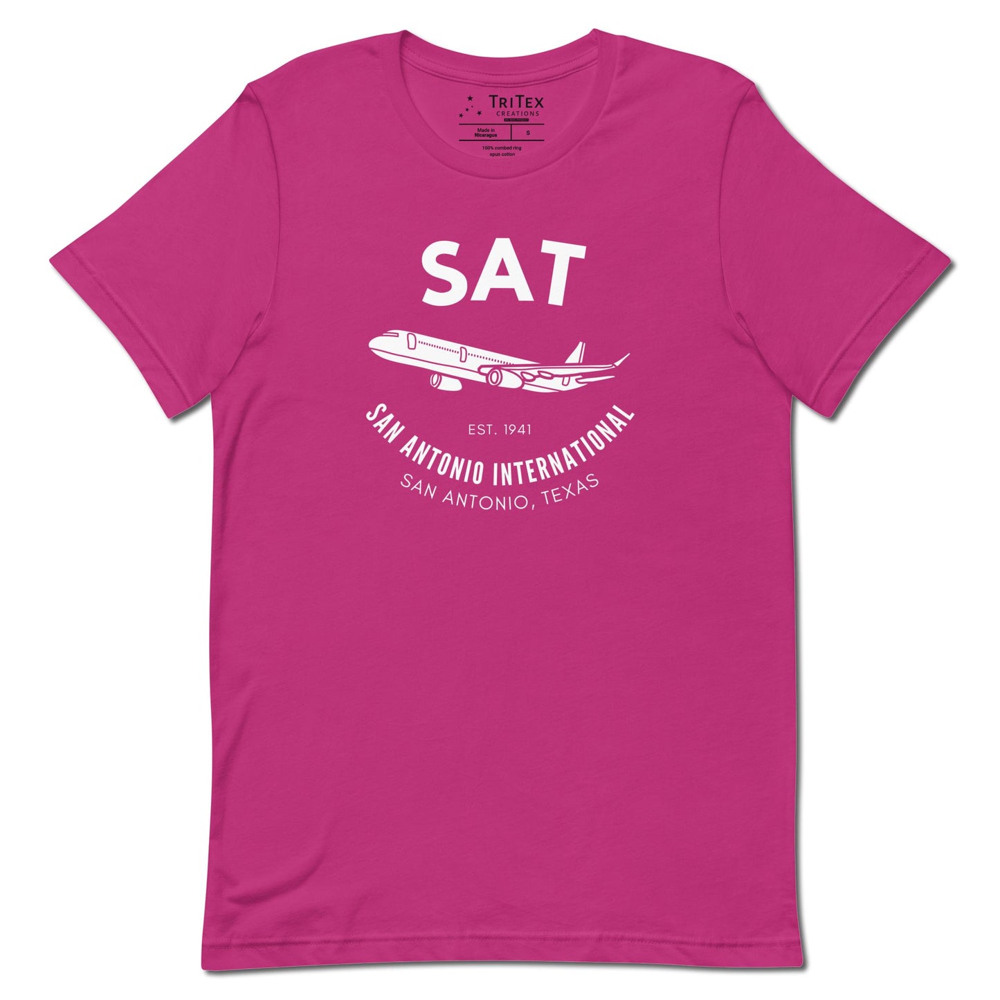 A berry pink t-shirt featuring a silhouette of a passenger plane with the text "SAT. Est. 1941. San Antonio International. San Antonio, Texas".