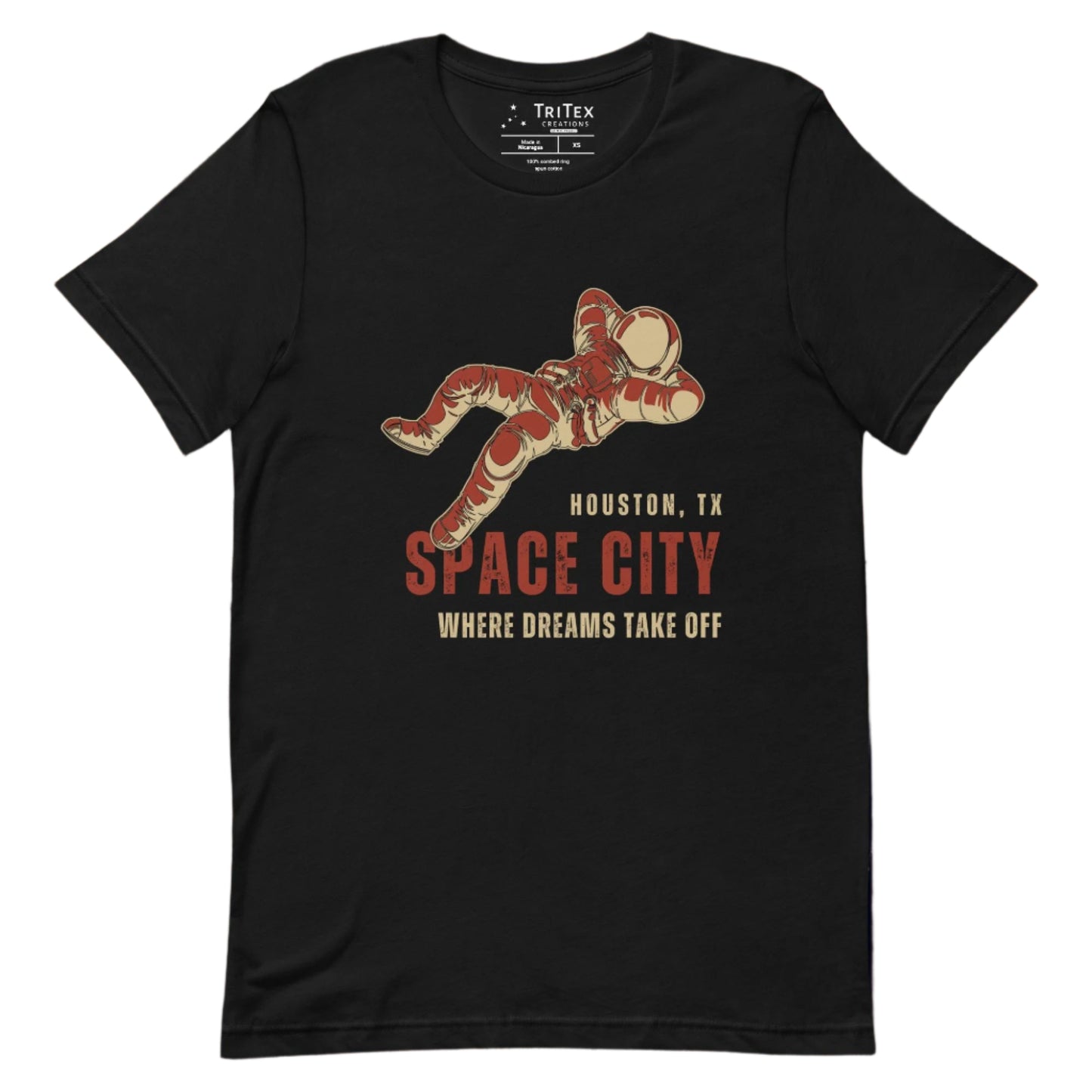 A black t-shirt featuring a dreaming astronaut with the words "Houston, TX. Space city. Where dreams come true".