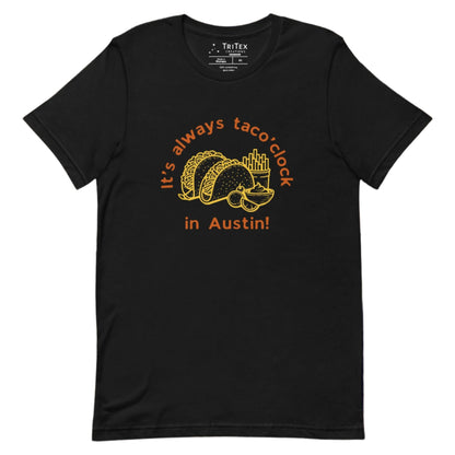 A black t-shirt featuring a taco meal with french fries and guacomole with the text "It's always taco'clock in Austin!".