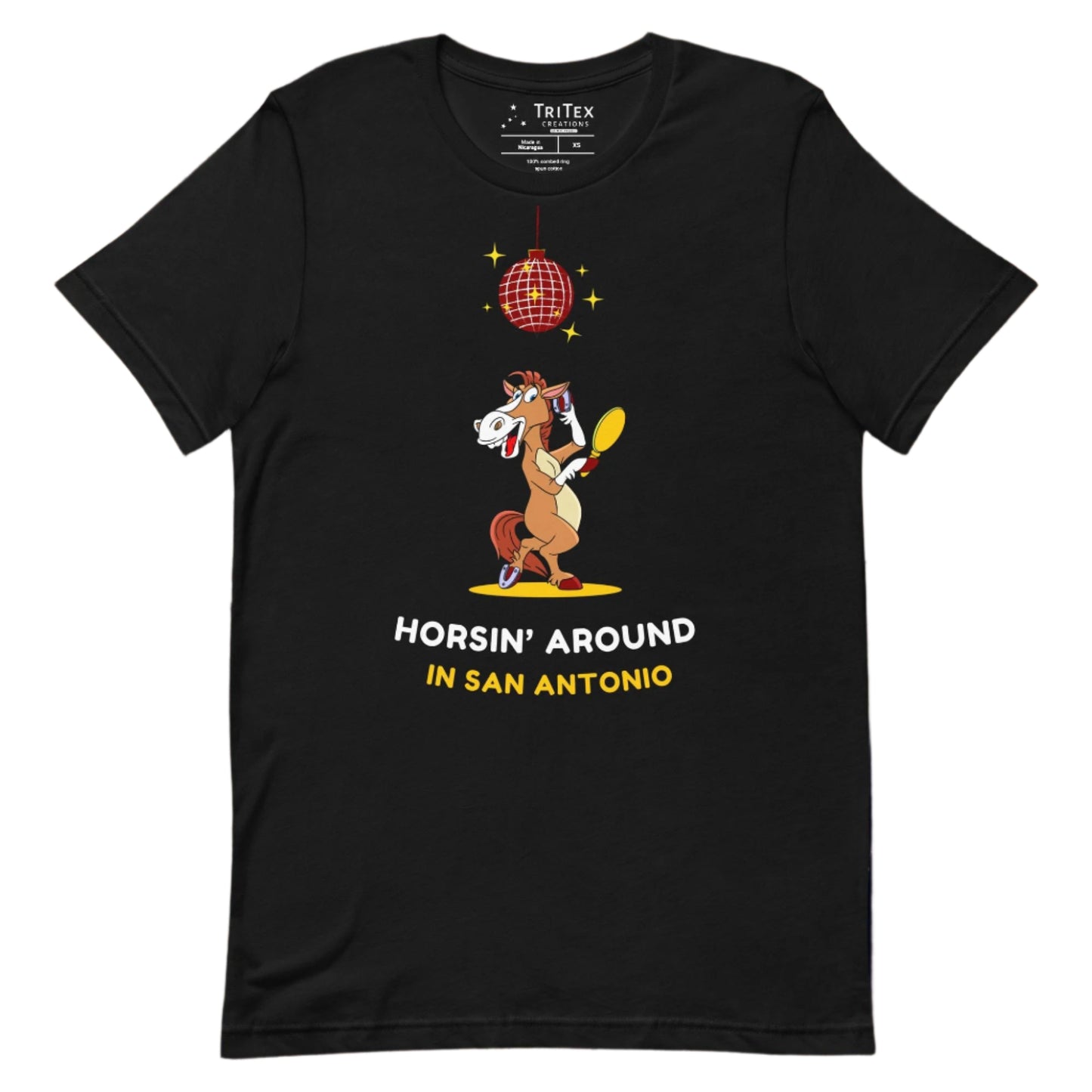 A black t-shirt featuring an image of a cartoon horse primping under a sparkling disco ball with the words "Horsin' around in San Antonio".