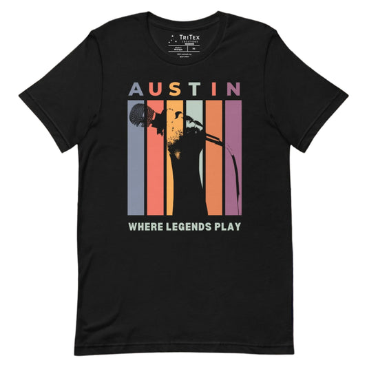 A black t-shirt featuring a silhouette of a hand holding a microphone with the words "Austin. Where legends play".