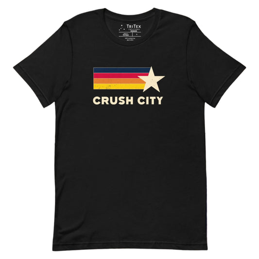 A black t-shirt featuring blue, red, orange, yellow stripes and a cream-colored star with the words "Crush city".