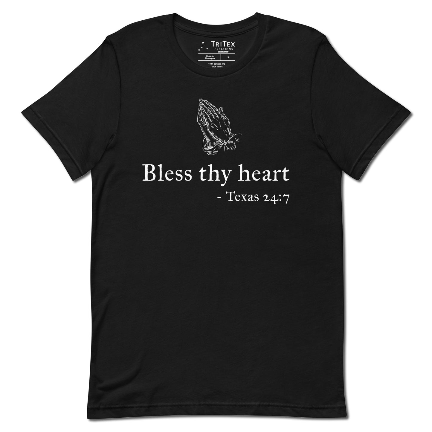 A black t-shirt featuring a vintage illustration of hands clasped in prayer with the words "Bless thy heart - Texas 24:7"