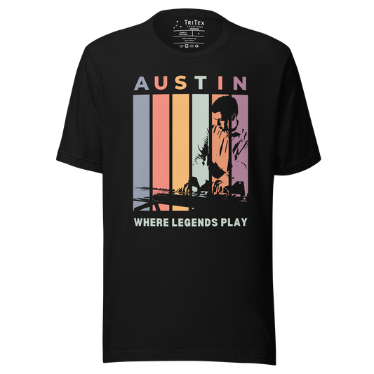 A black t-shirt featuring the silhouette of a keyboard player with the words "Austin. Where legends play".