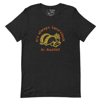 A black heather t-shirt featuring a taco meal with french fries and guacomole with the text "It's always taco'clock in Austin!".