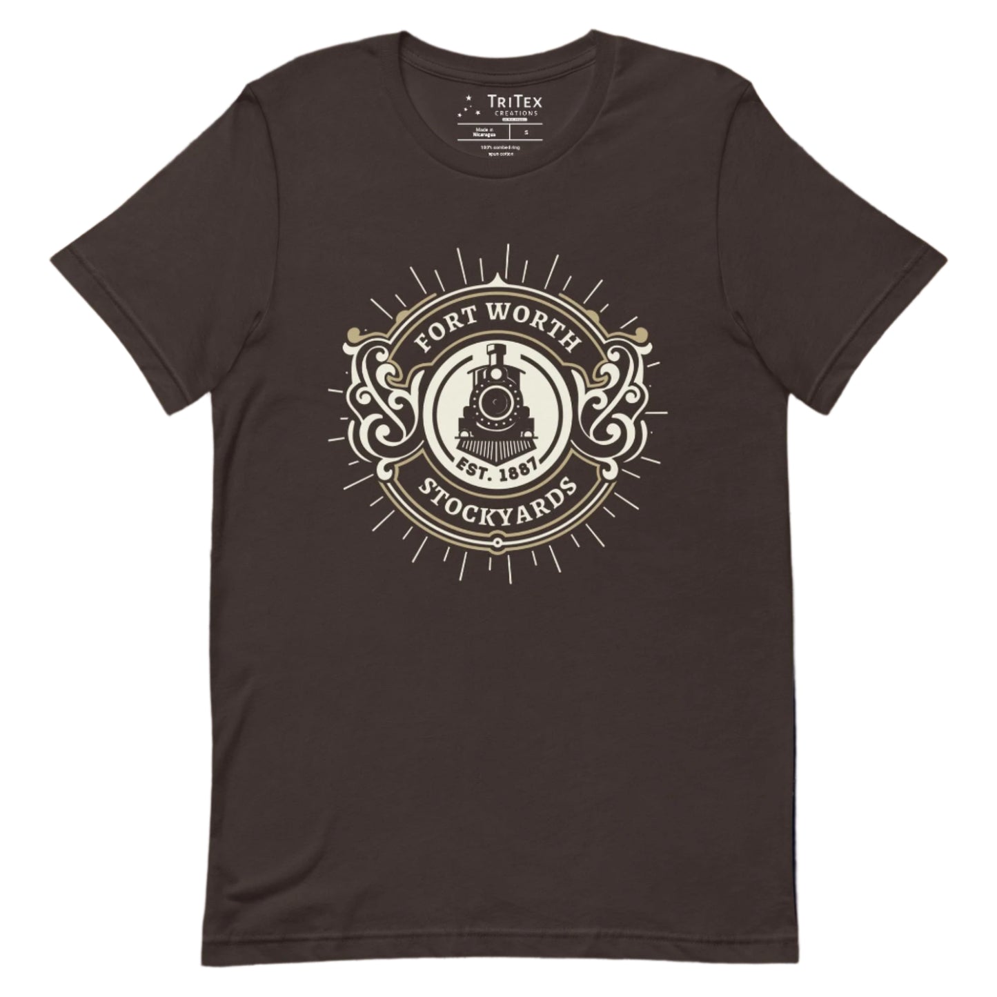 A brown t-shirt featuring a vintage locomotive and the text "Fort Worth Stockyards Est. 1887".