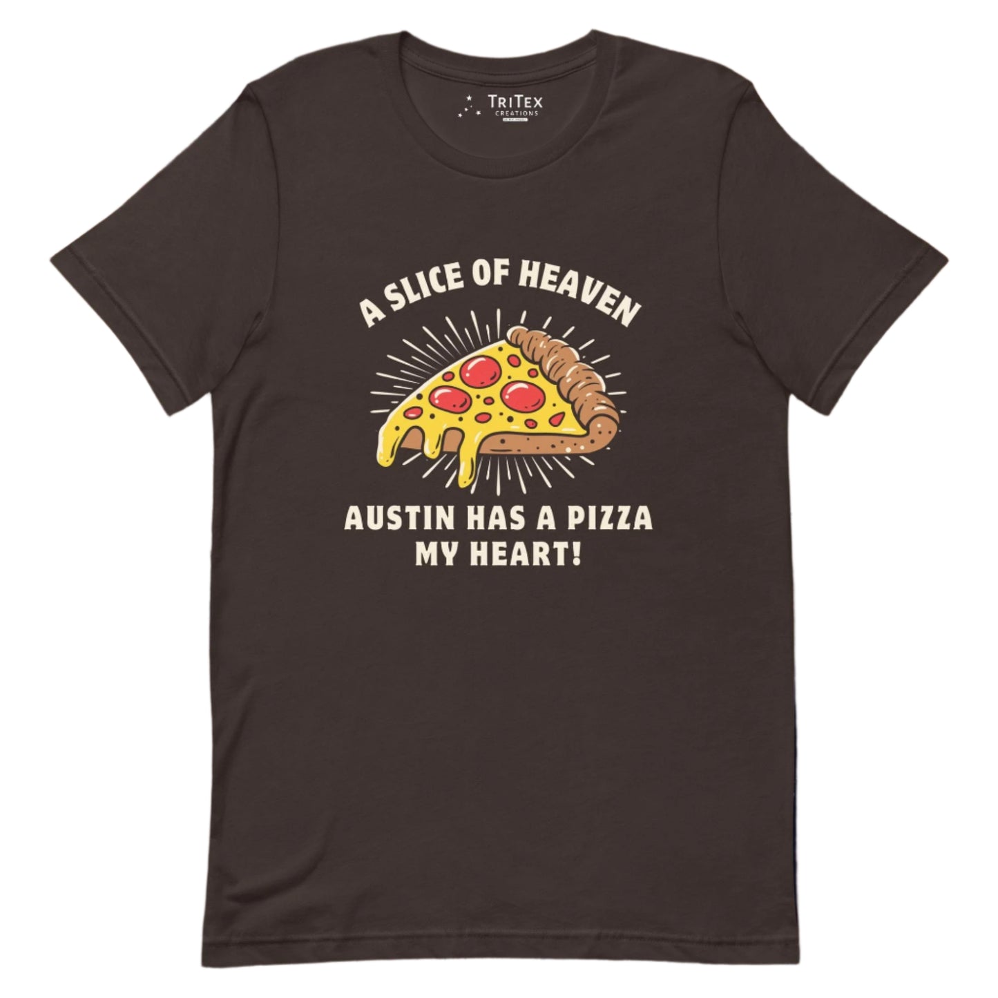 A brown t-shirt featuring an image of a slice of pizza with the words" A slice of heaven Austin has a pizza my heart!".