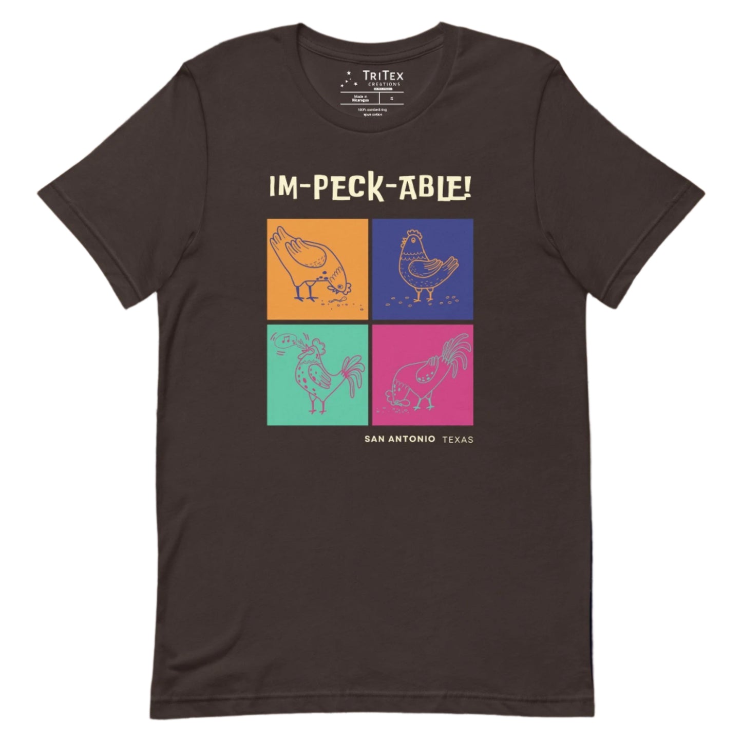 A brown t-shirt featuring cartoon chickens with the text "Im-peck-able! San Antonio Texas".