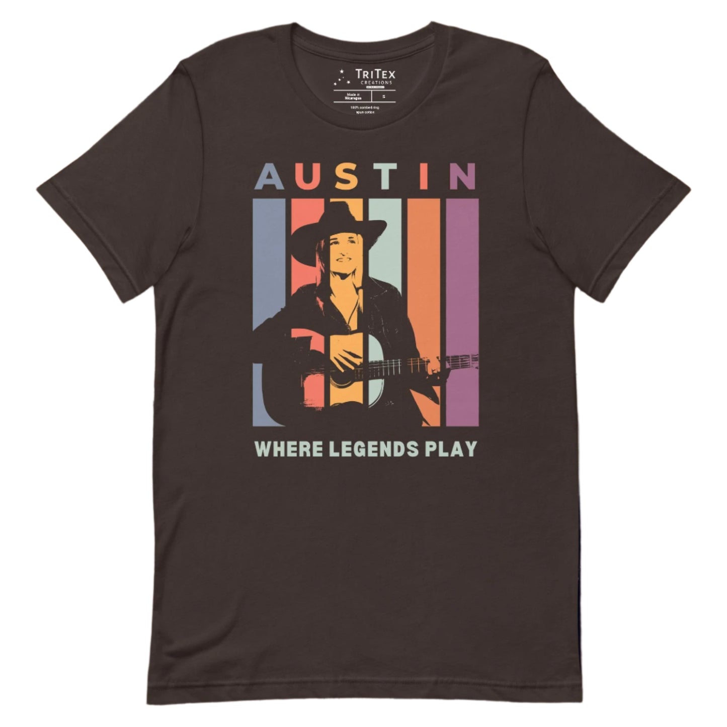 A brown t-shirt featuring a silhouette of a guitarist with the words "Austin. Where legends play".