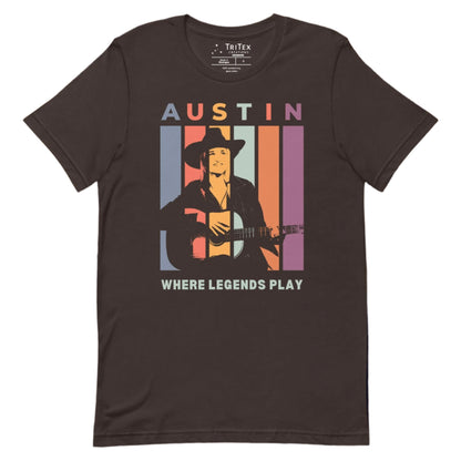 A brown t-shirt featuring a silhouette of a guitarist with the words "Austin. Where legends play".