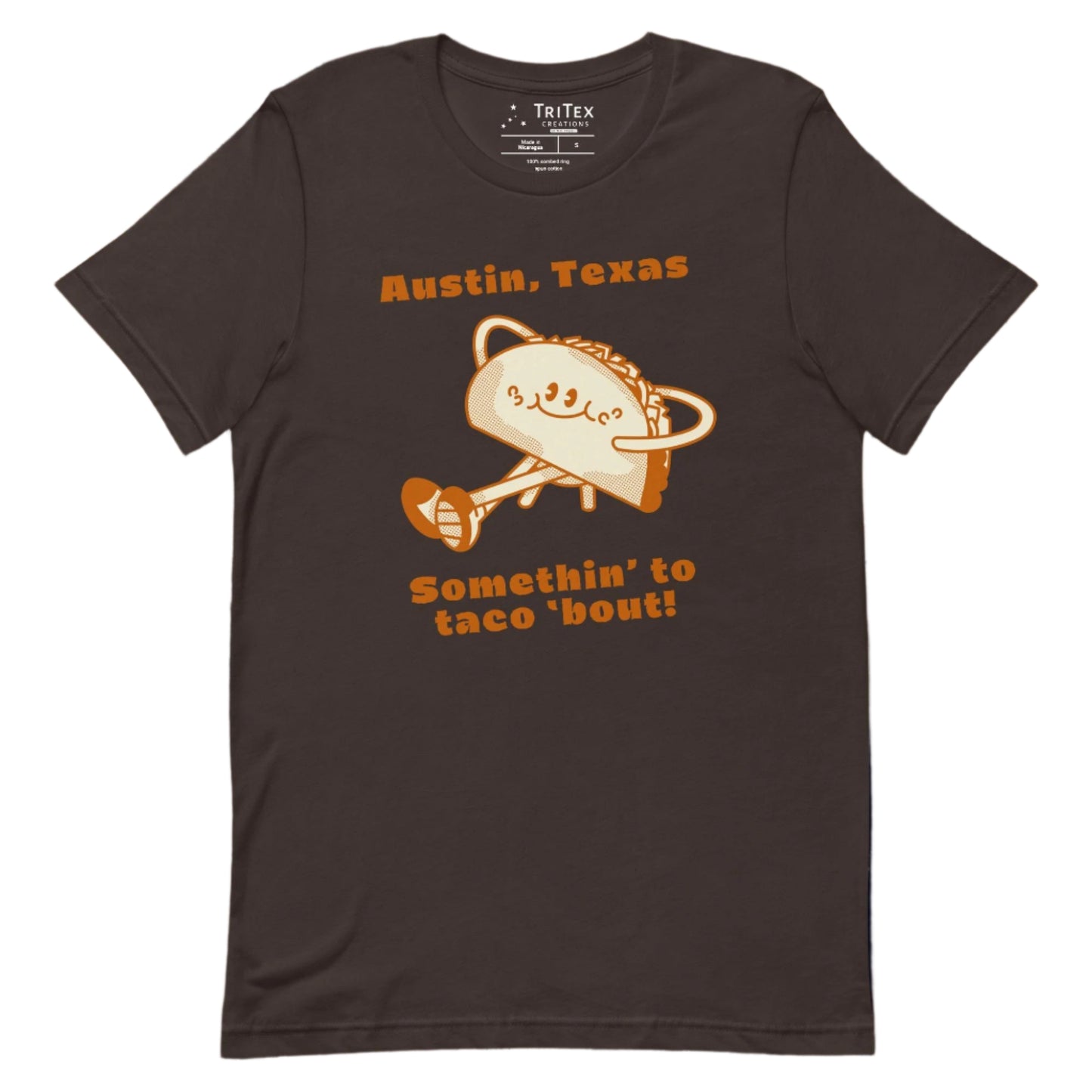 A brown shirt featuring a taco lounging with the text "Austin, Texas. Somethin' to taco 'bout!"