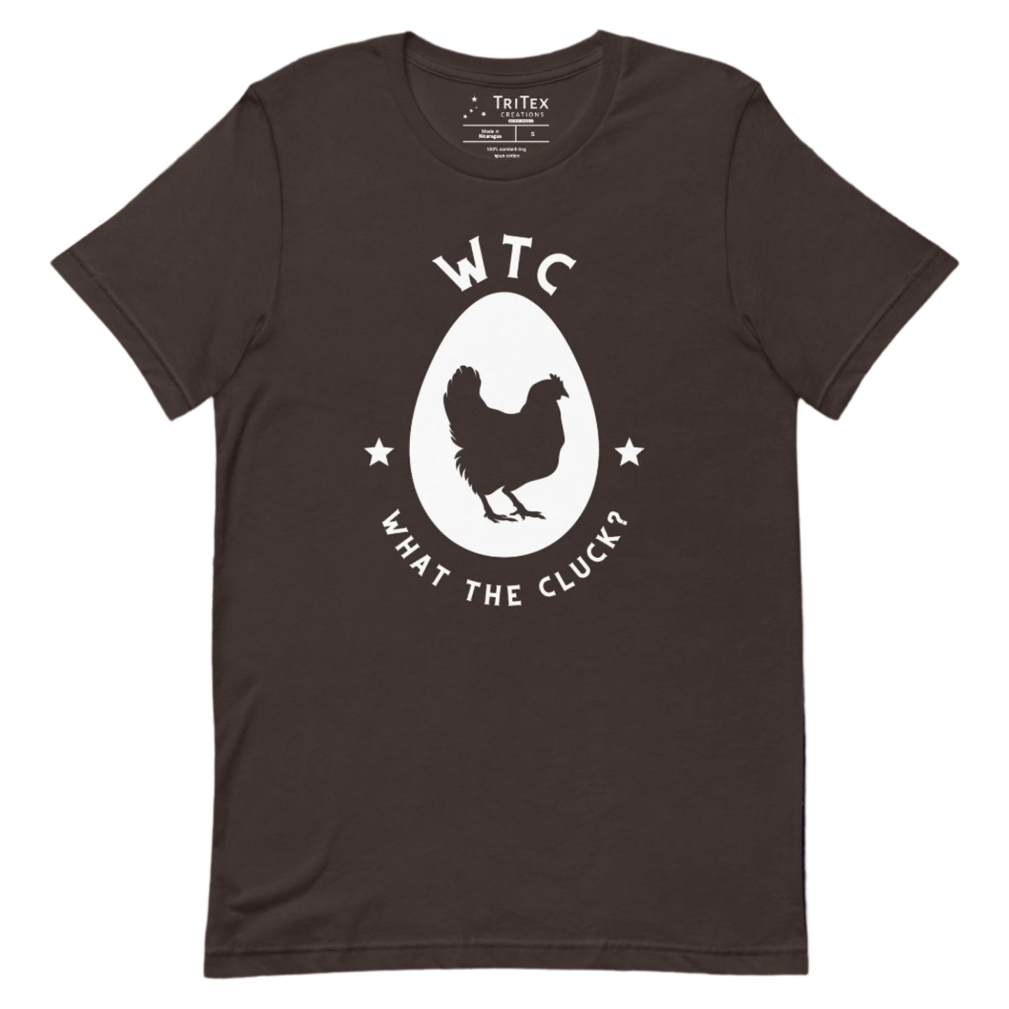 A brown t-shirt featuring a silhouette of a chicken in an egg with the words "WTC What the cluck".