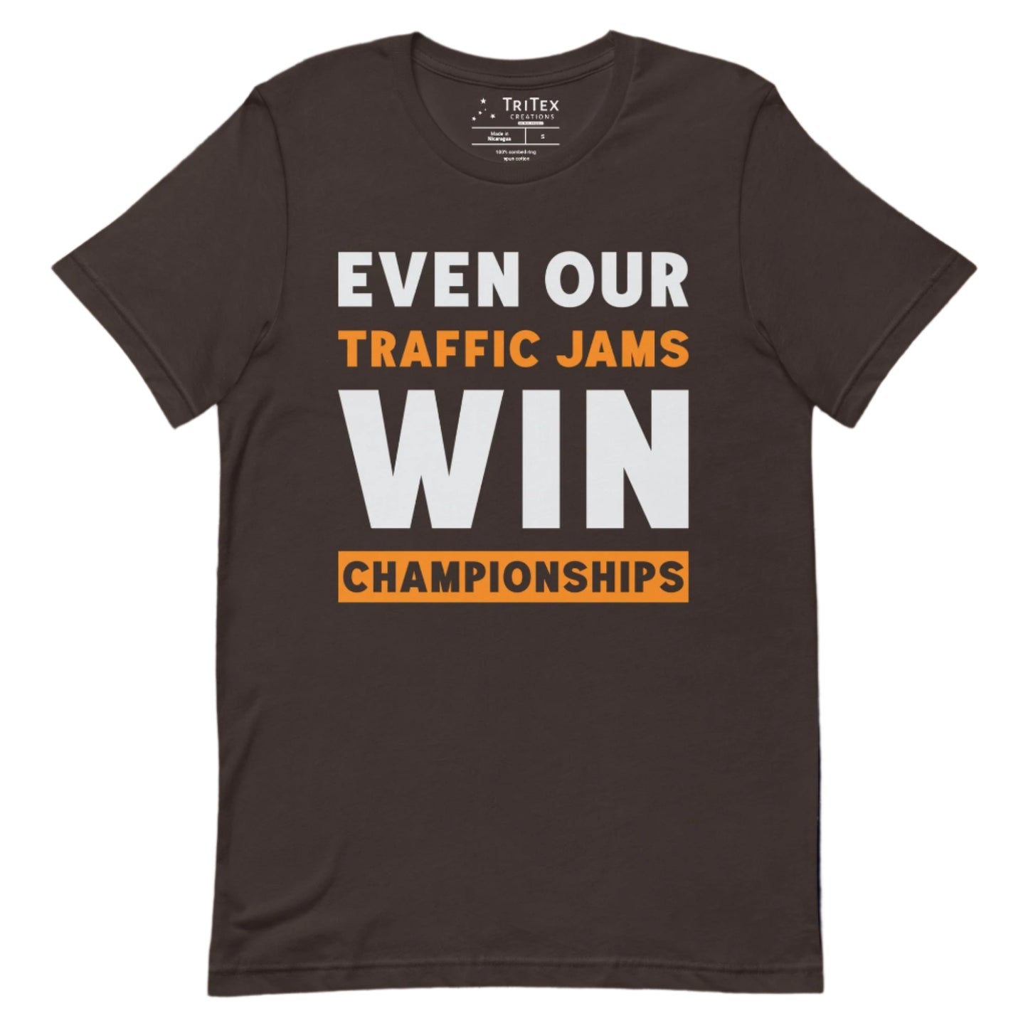 A brown t-shirt with text reading "Even Our Traffic Jams Win Championships".