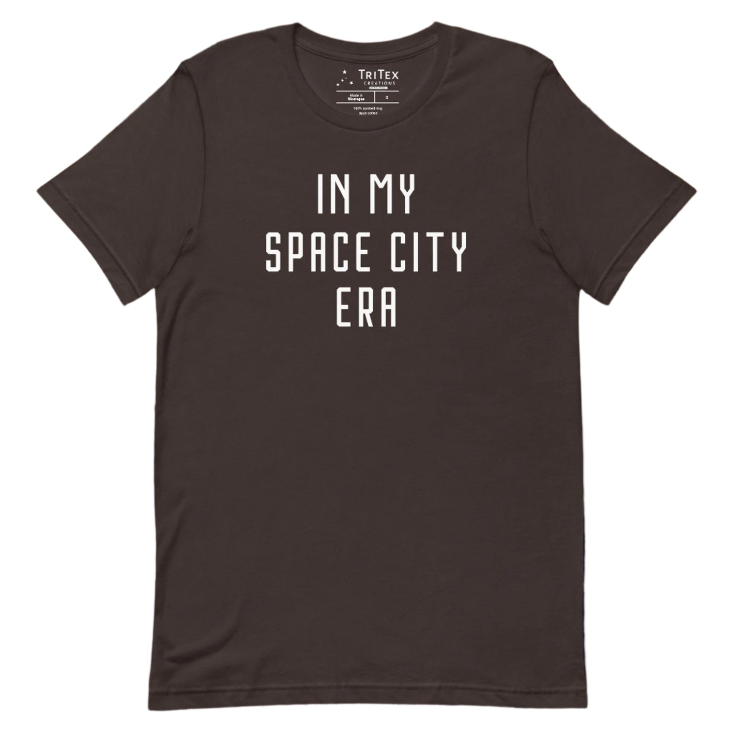 A brown t-shirt that reads "In my space city era".