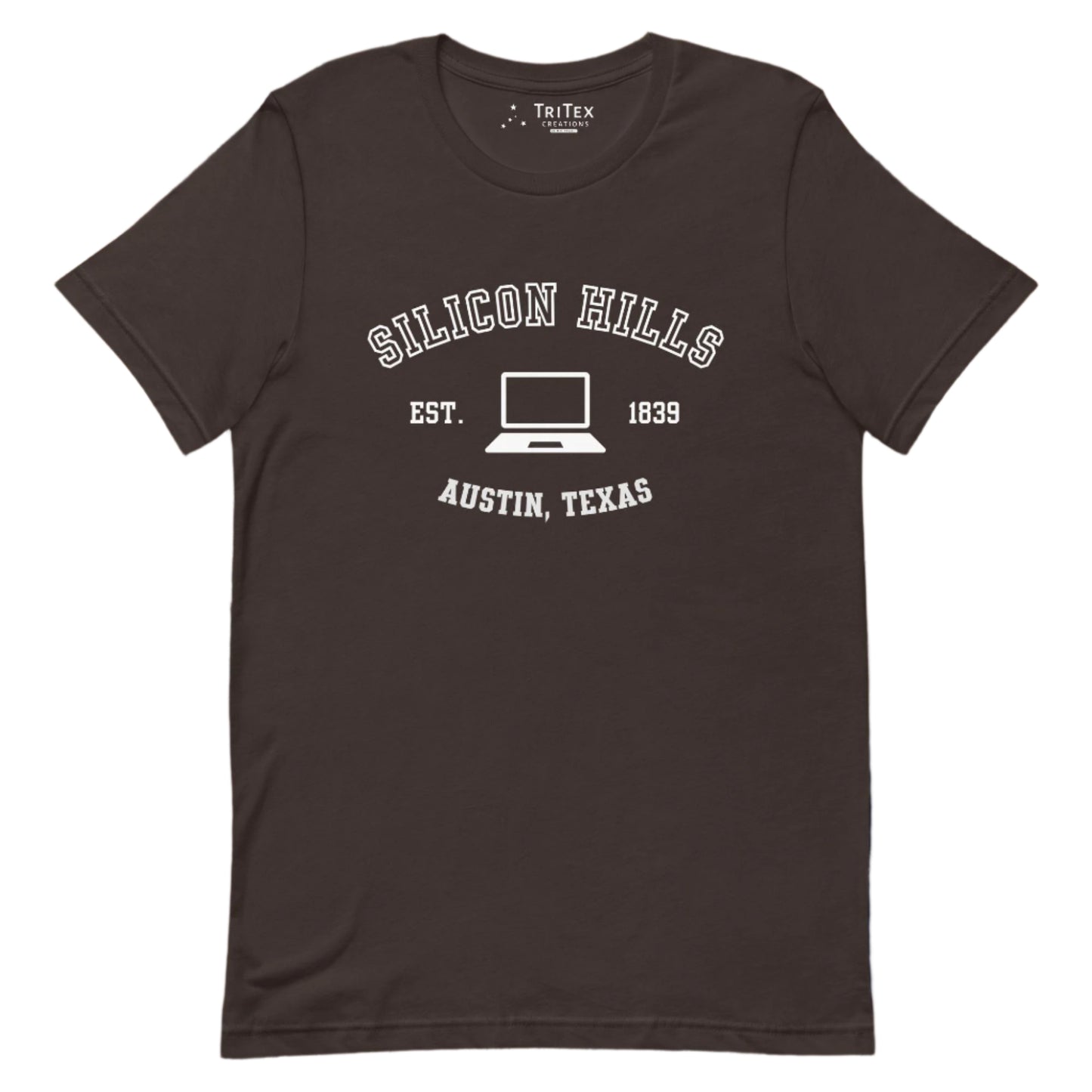 A brown t-shirt featuring a graphic image of a laptop with the words "Silicon Hills Est. 1839 Austin, Texas".