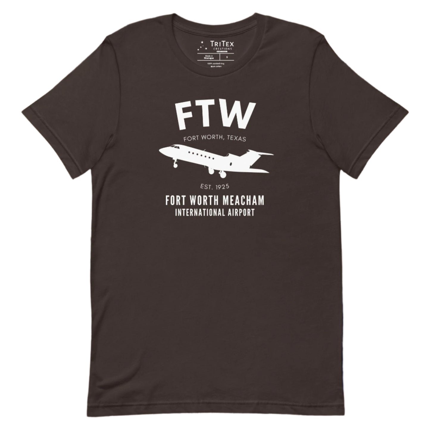 A brown t-shirt featuring a small passenger jet with the words "FTW Fort Worth, Texas Est. 1925. Fort Worth Meacham International Airport".