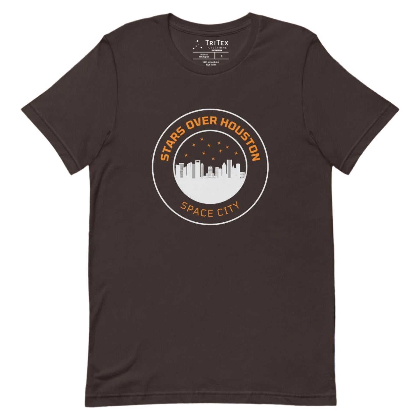 A brown t-shirt featuring the Houston skyline underneath a starry sky with the words "Stars over Houston. Space City".