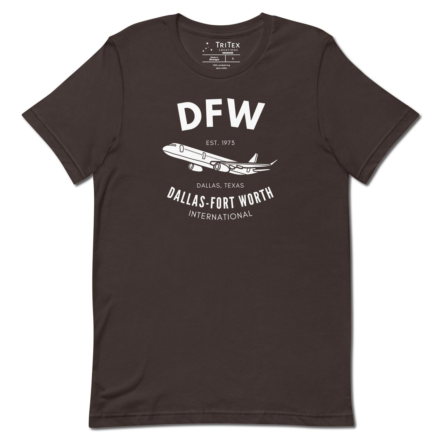 A brown t-shirt featuring a silhouette of a passenger plane with the text "DFW. Est. 1973. Dallas, Texas. Dallas-Fort Worth International".