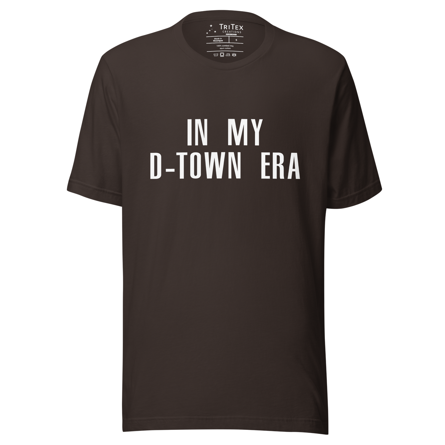 A brown t-shirt featuring with the text "In my D-Town era".