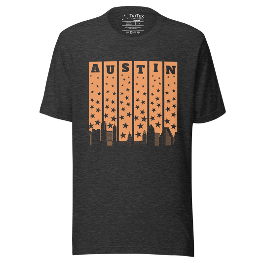 A dark gray t-shirt with the words Austin above a silhouette of stars and the Austin skyline.