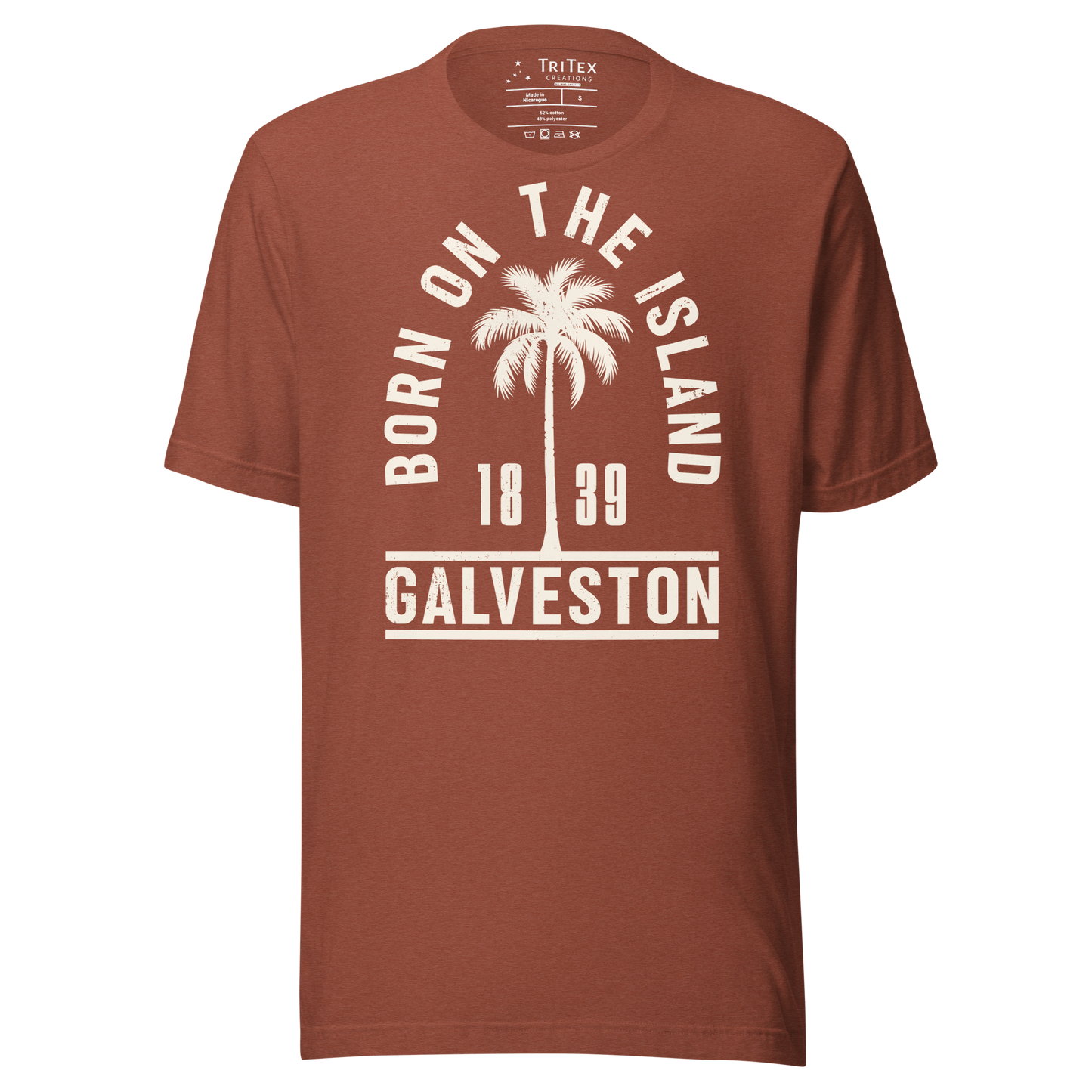 A heather clay t-shirt featuring a palm tree with the words "Born on the island. Galveston 1839" with a silhouette of a palm tree.
