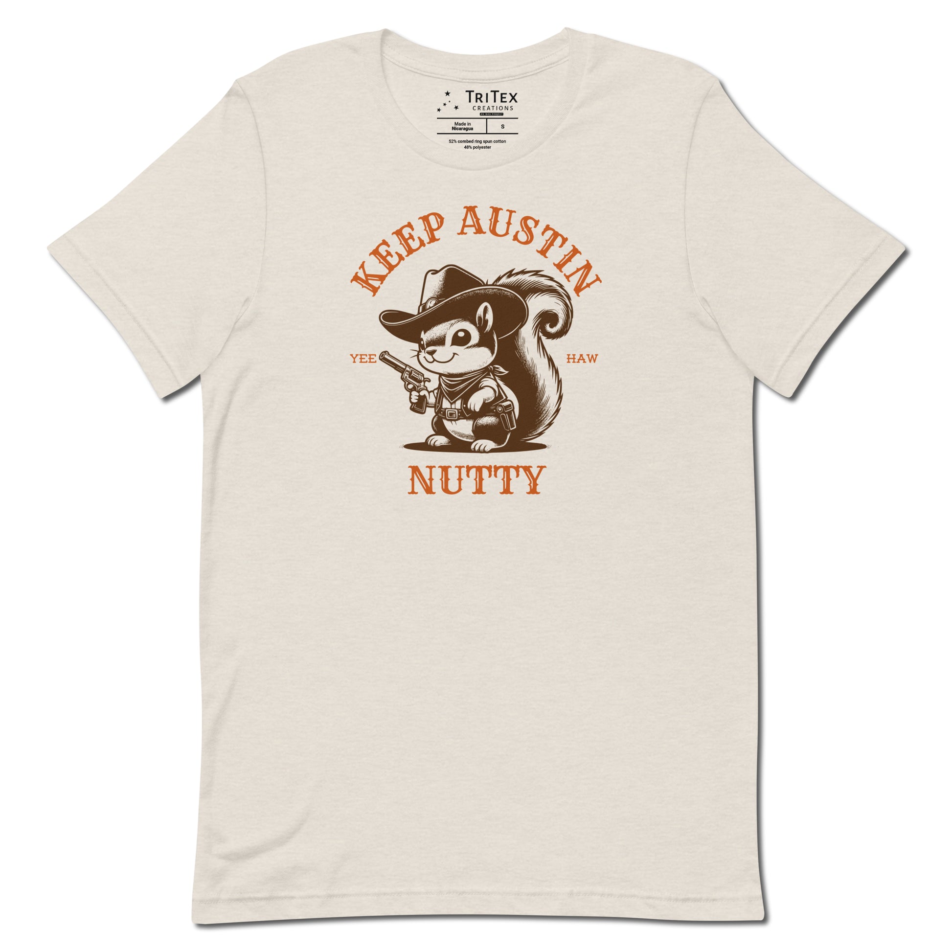 A heather dust t-shirt featuring a vintage illustration of a squirrel dressed like a cowboy with text that reads "Keep Austin Nutty. Yee Haw".