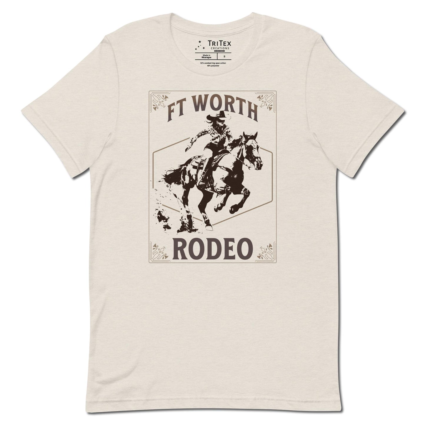 A heather dust t-shirt featuring a cowgirl on a horse with a decorative border and the words "Ft Worth Rodeo".