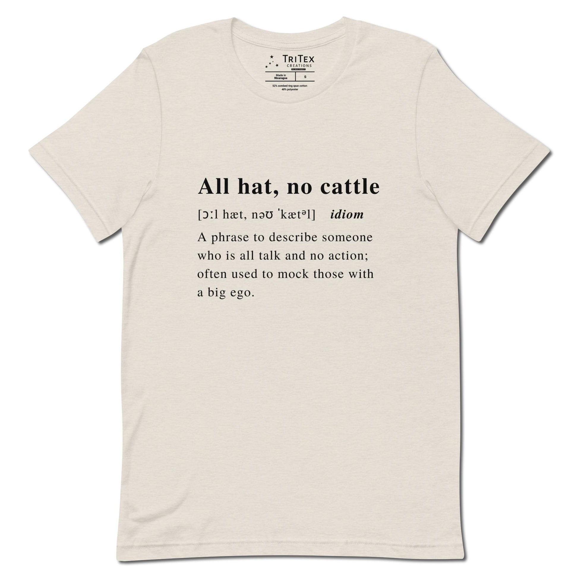 A heather dust t-shirt with the definition of "All hat, no cattle" styled like a dictionary entry.