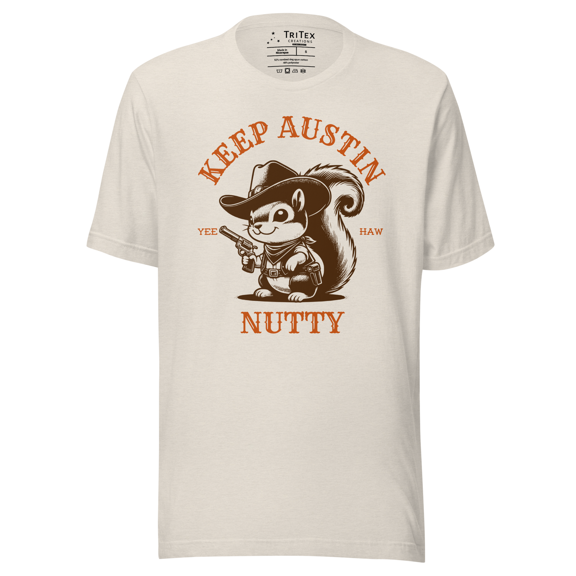 A heather dust t-shirt featuring a vintage illustration of a squirrel dressed like a cowboy with text that reads "Keep Austin Nutty. Yee Haw".