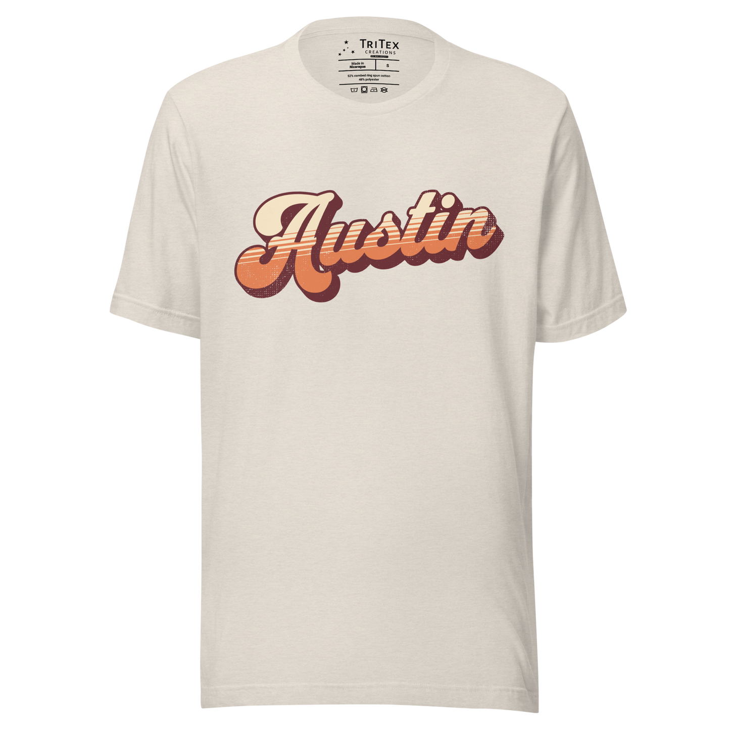 A heather dust colored t-shirt with a retro style Austin in a vintage font.