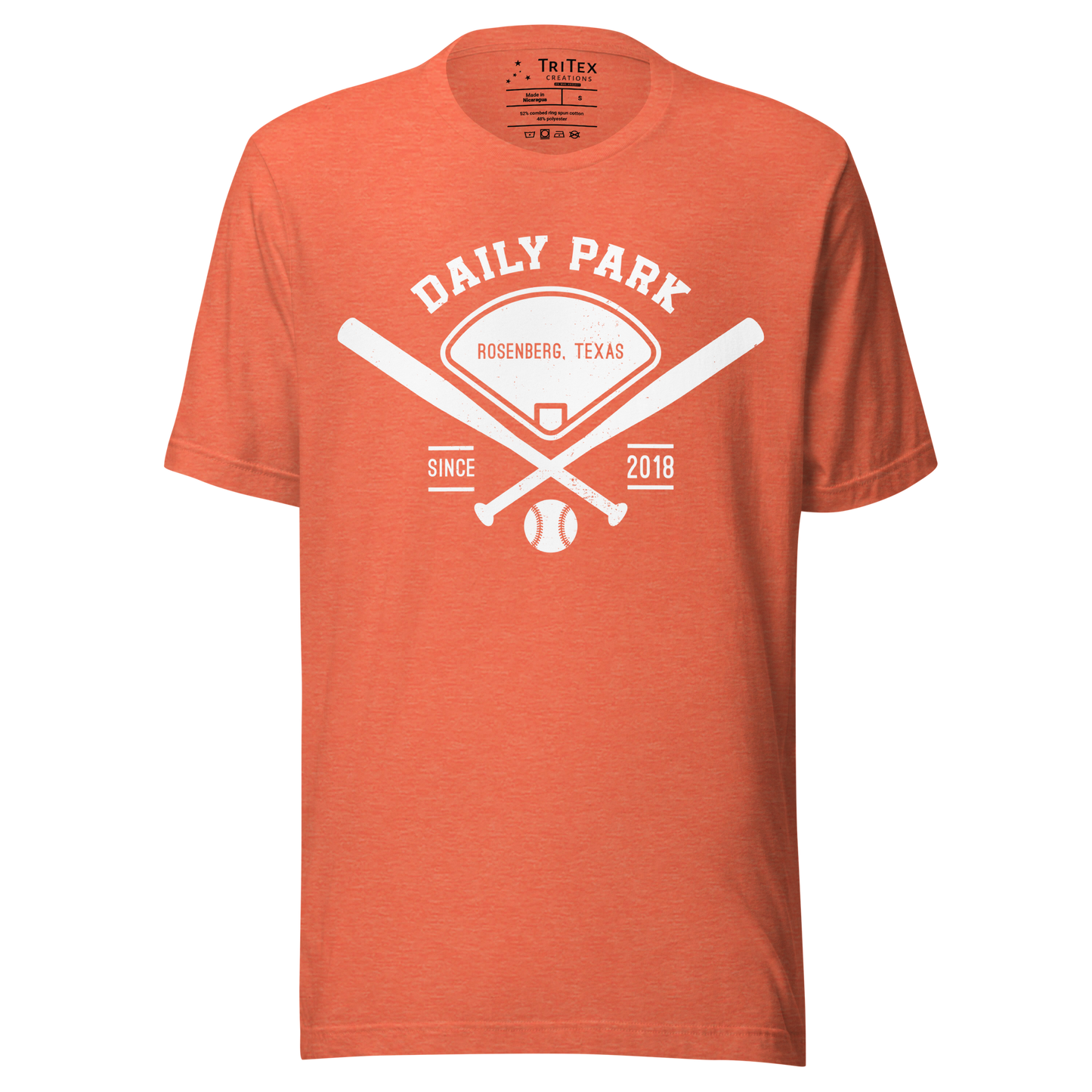 A heather orange t-shirt featuring two crisscrossed baseball bats, a baseball diamond and a baseball with the words "Daily Park Rosenberg, Texas Since 2018".