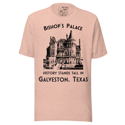 A heather prism peach t-shirt featuring a vintage-style picture of Bishop's Palace with the text "Bishop's Palace. History stands tall in Galveston, Texas".