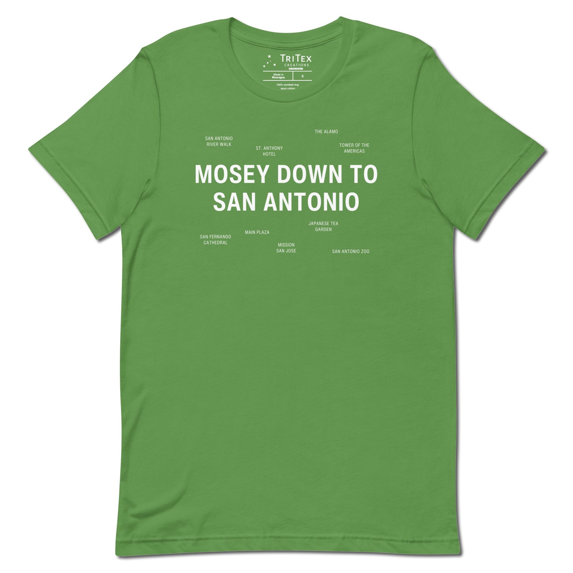 A leaf-green t-shirt which reads "Mosey Down To San Antonio" in big, bold text with smaller text elements naming San Antonio's landmarks.