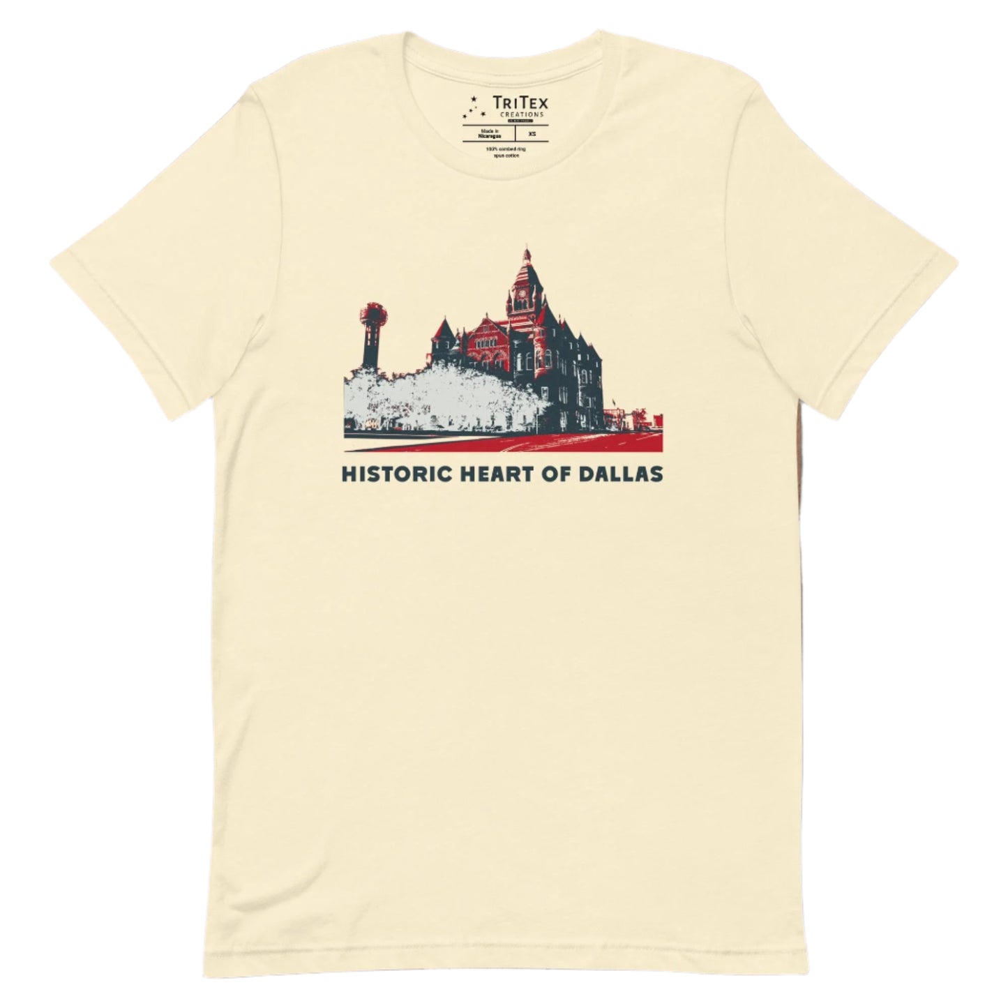 A natural-colored t-shirt picturing the county courthouse and Reunion Tower in Dallas with the text "Historic heart of Dallas".