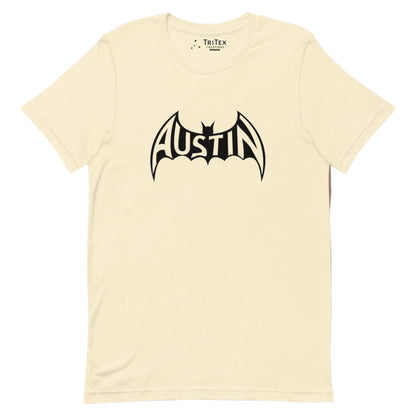 A natural-colored t-shirt featuring a silhouette of a bat with Austin inside.