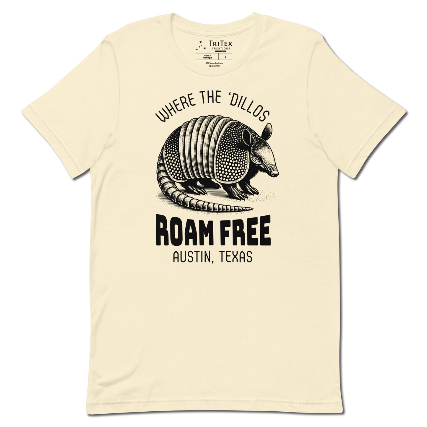 A natural-colored t-shirt featuring a vintage illustration of an armadillo with the words "Where the 'dillos roam free. Austin, Texas".