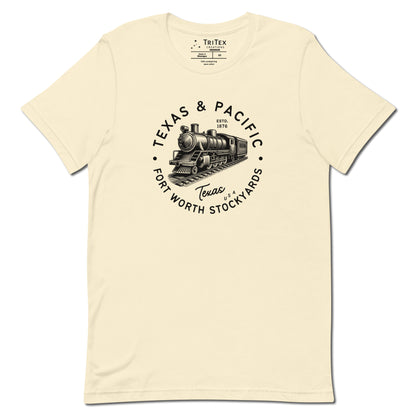 A natural-colored t-shirt featuring a vintage illustration of a locomotive with the words "Texas & Pacific. Fort Worth Stockyards. Texas USA".