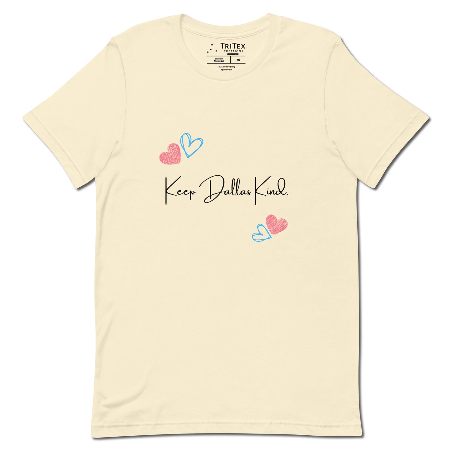 A  natural-colored t-shirt with hearts and the text "Keep Dallas Kind".