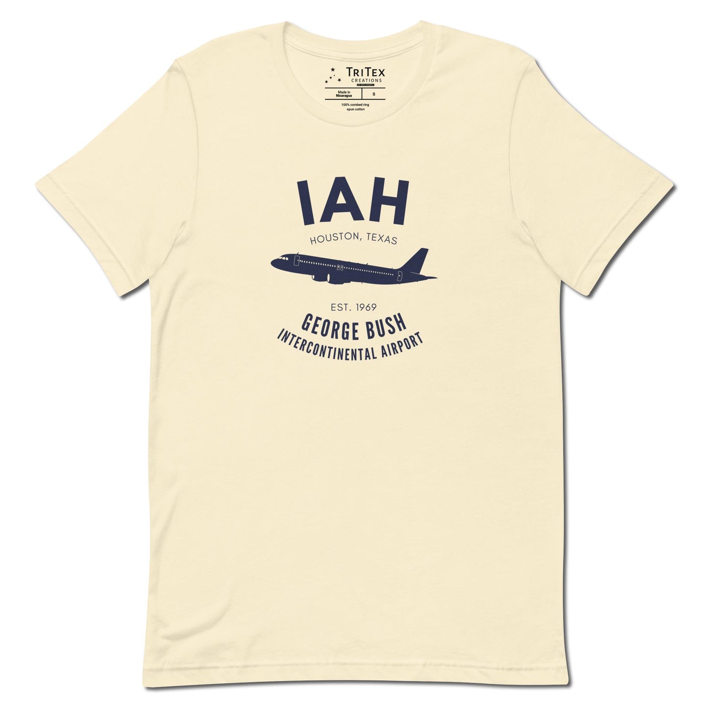 A natural-colored t-shirt with a silhouette of a passenger plane with the text "IAH Houston, Texas EST. 1969 George Bush Intercontinental Airport".