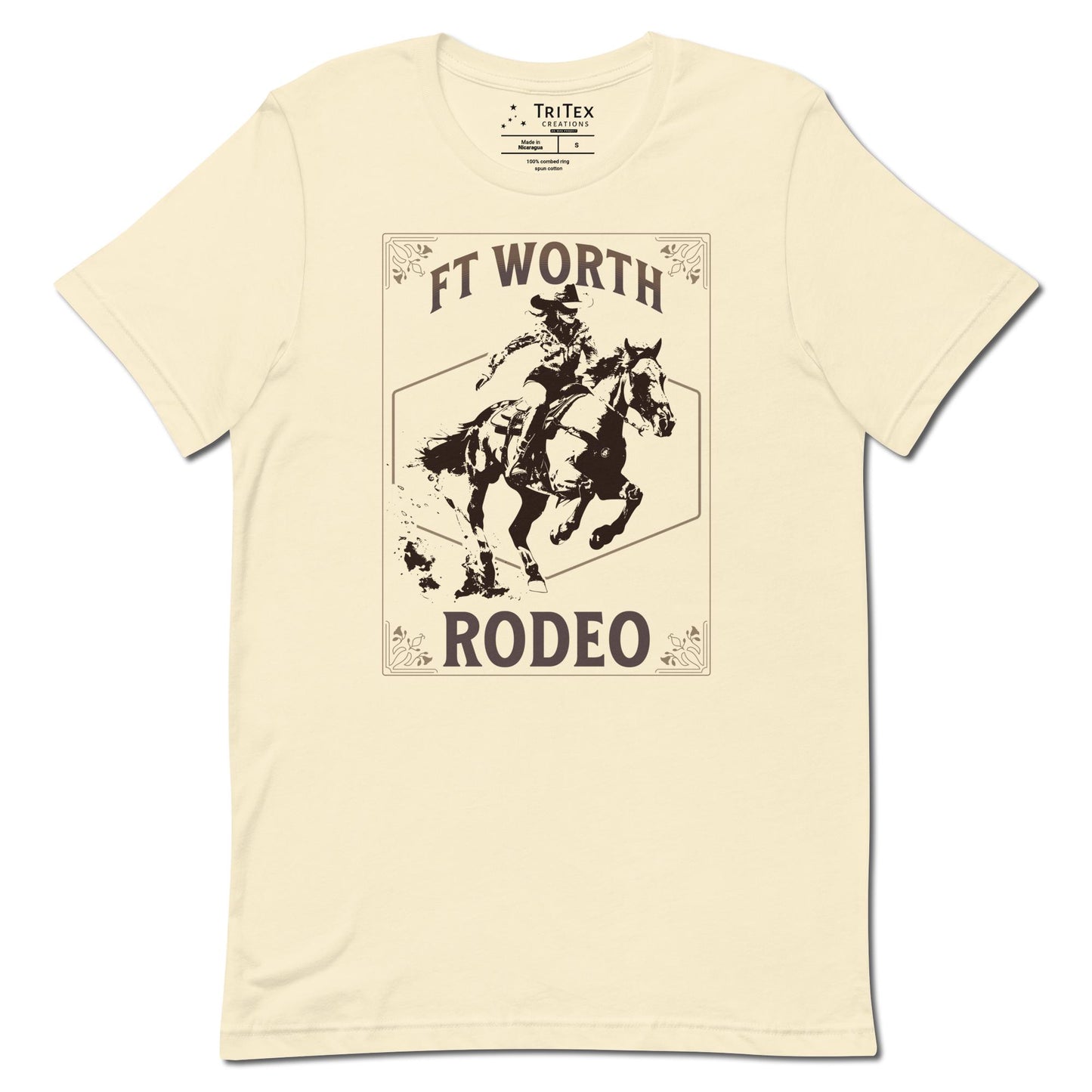 A natural-colored t-shirt featuring a cowgirl on a horse with a decorative border and the words "Ft Worth Rodeo".