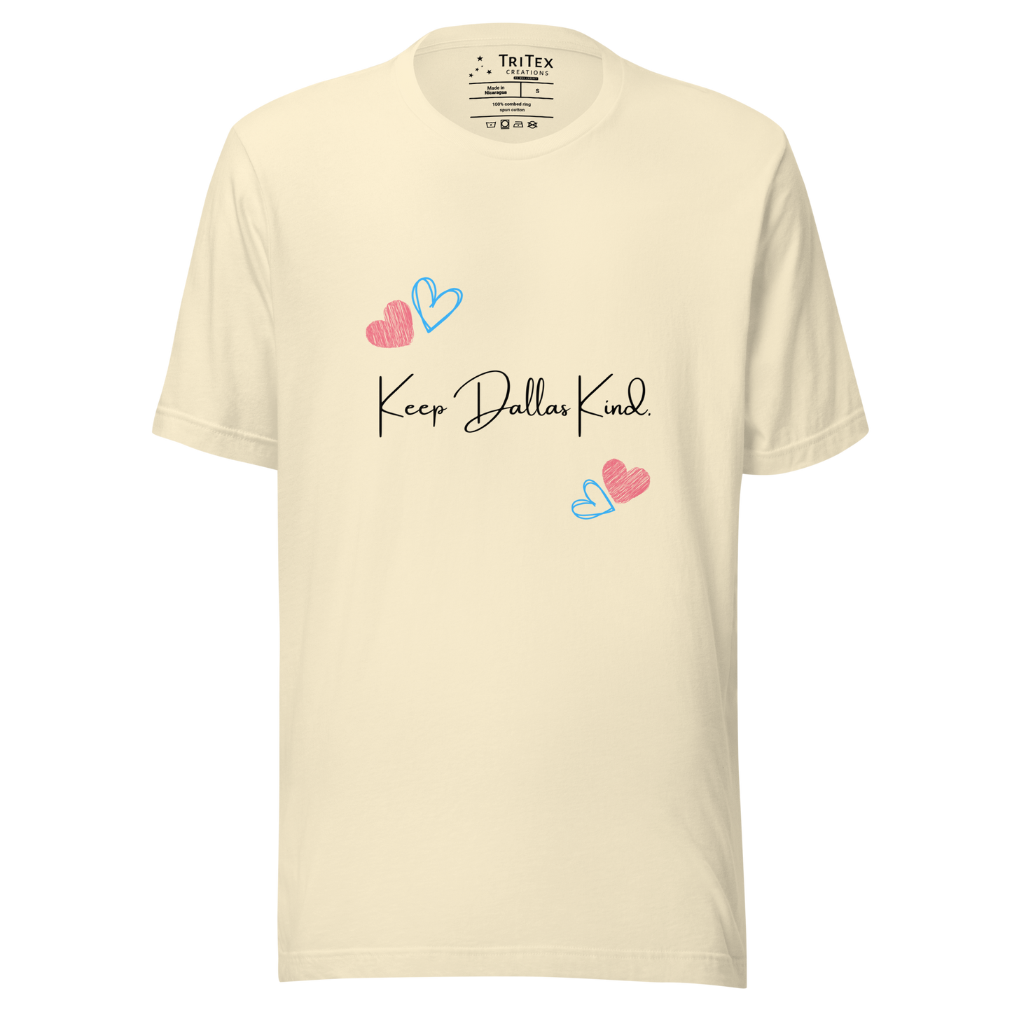 A natural-colored t-shirt with hearts and the text "Keep Dallas Kind".