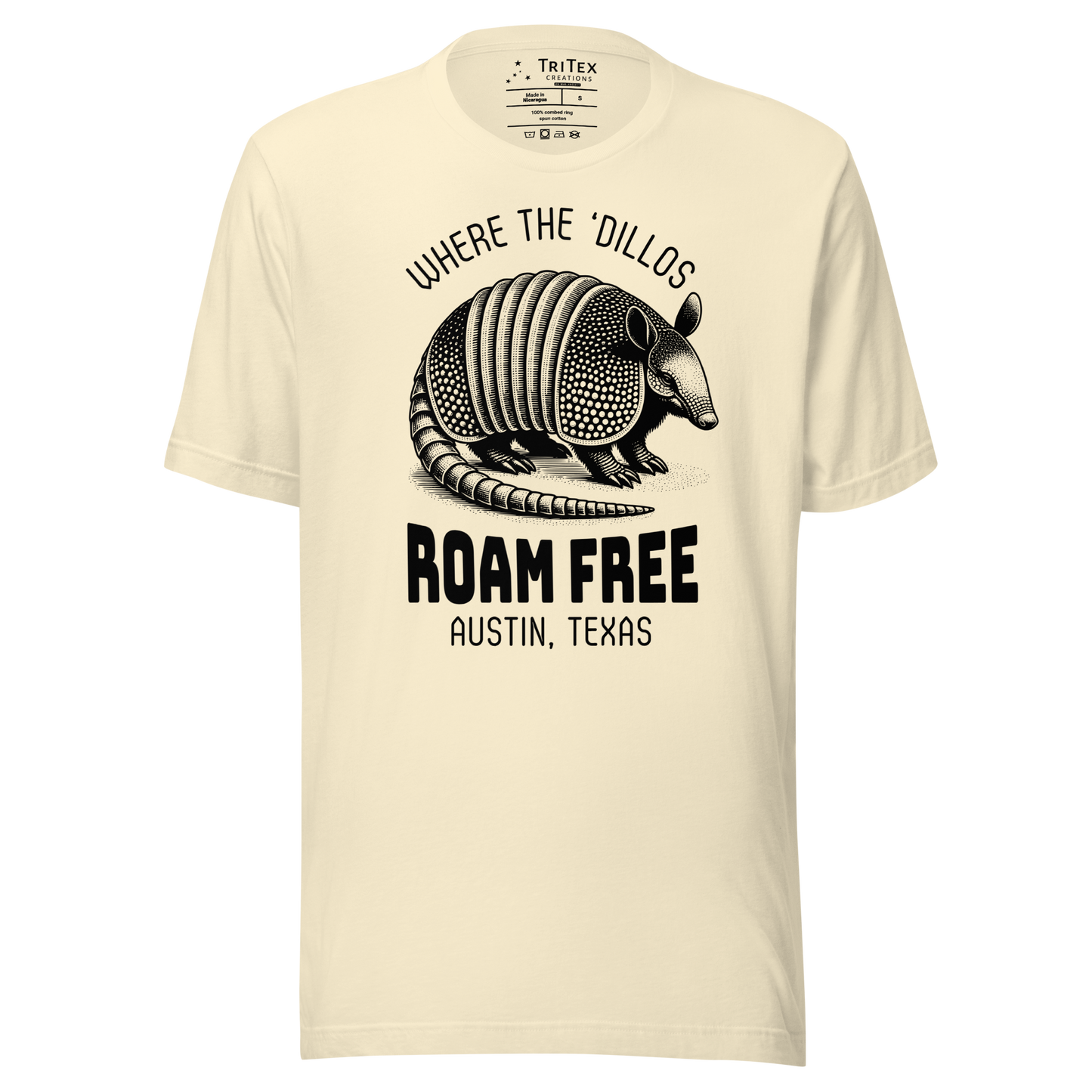 A natural-colored t-shirt featuring a vintage illustration of an armadillo with the words "Where the 'dillos roam free. Austin, Texas".