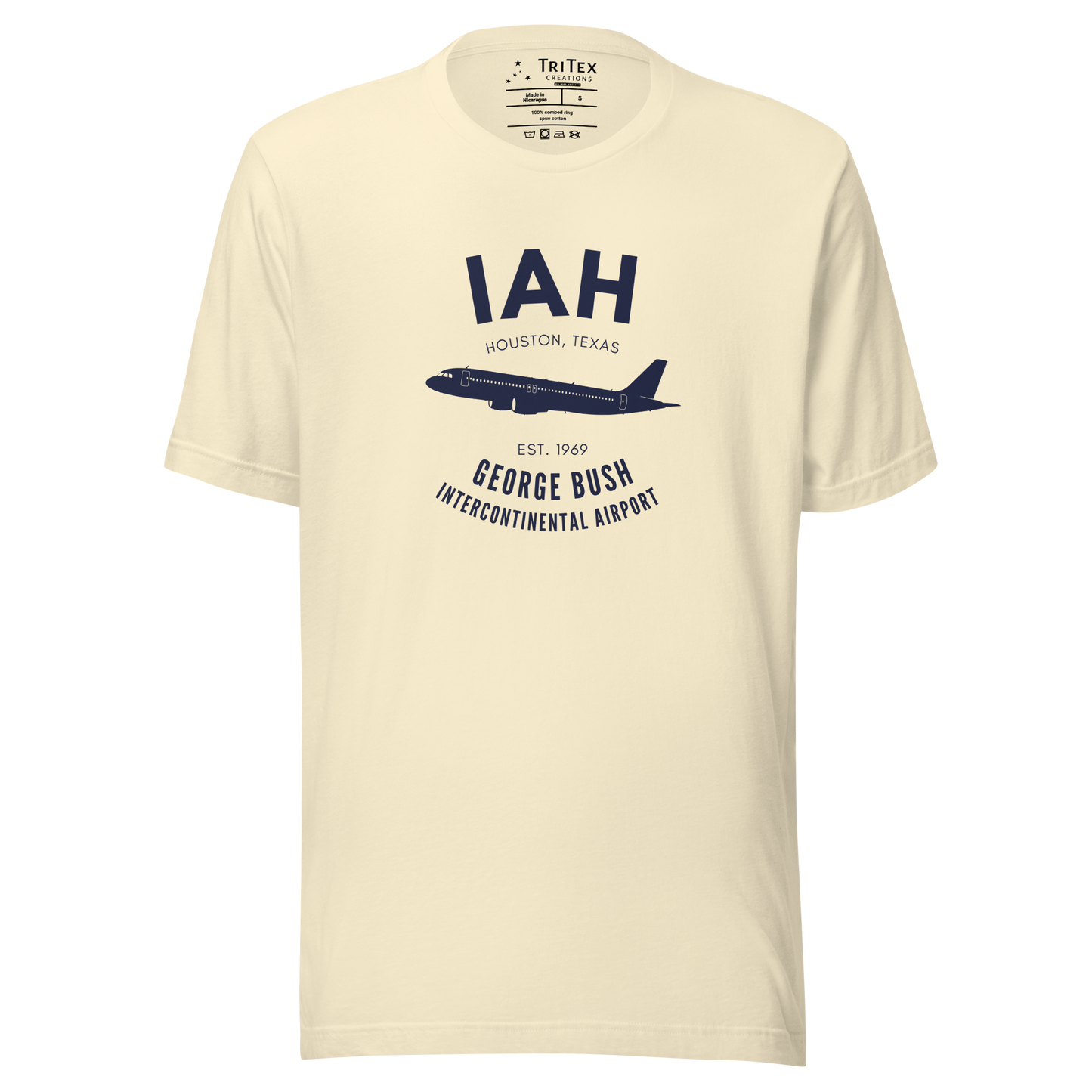 A natural-colored t-shirt with a silhouette of a passenger plane with the text "IAH Houston, Texas EST. 1969 George Bush Intercontinental Airport".