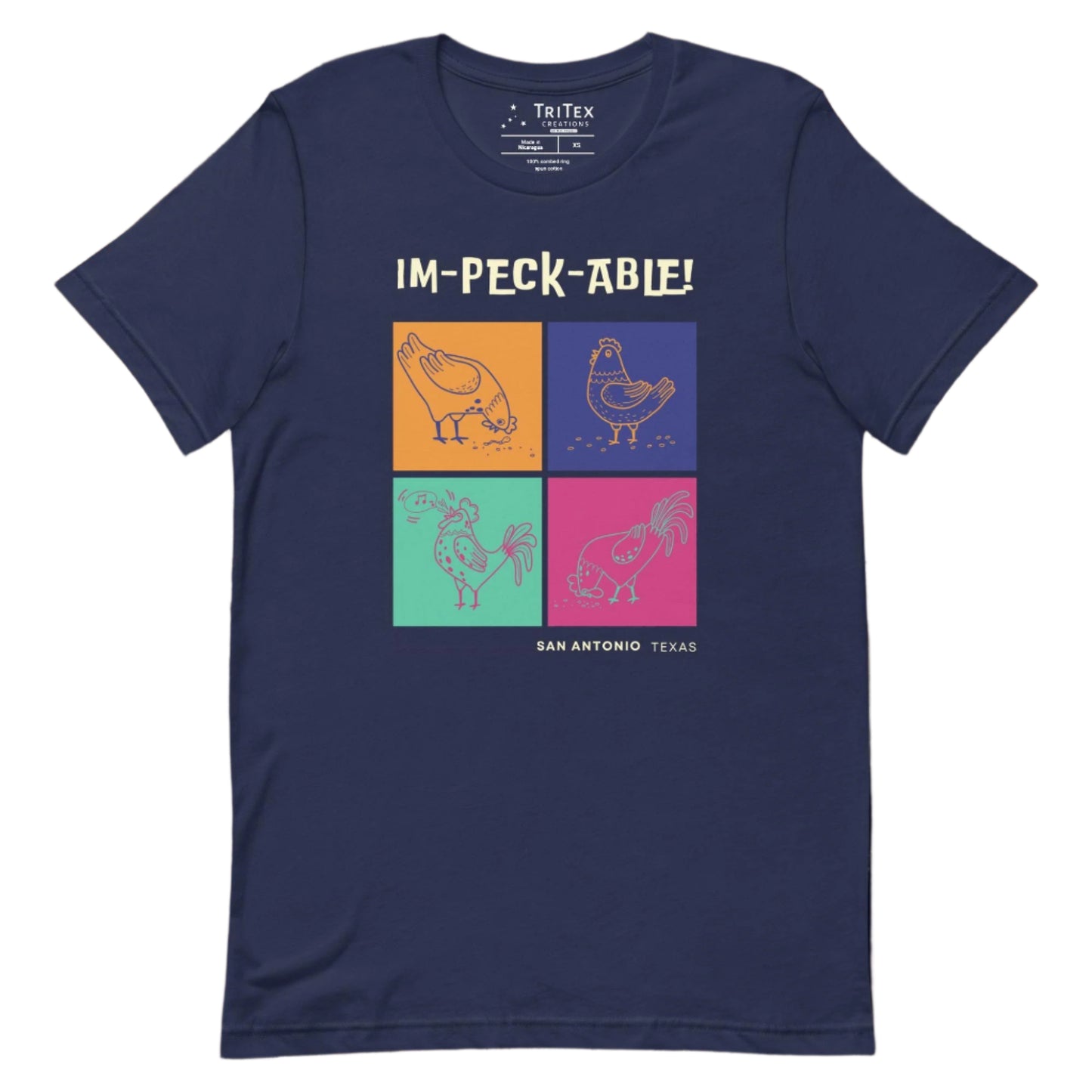 A navy t-shirt featuring cartoon chickens with the text "Im-peck-able! San Antonio Texas".