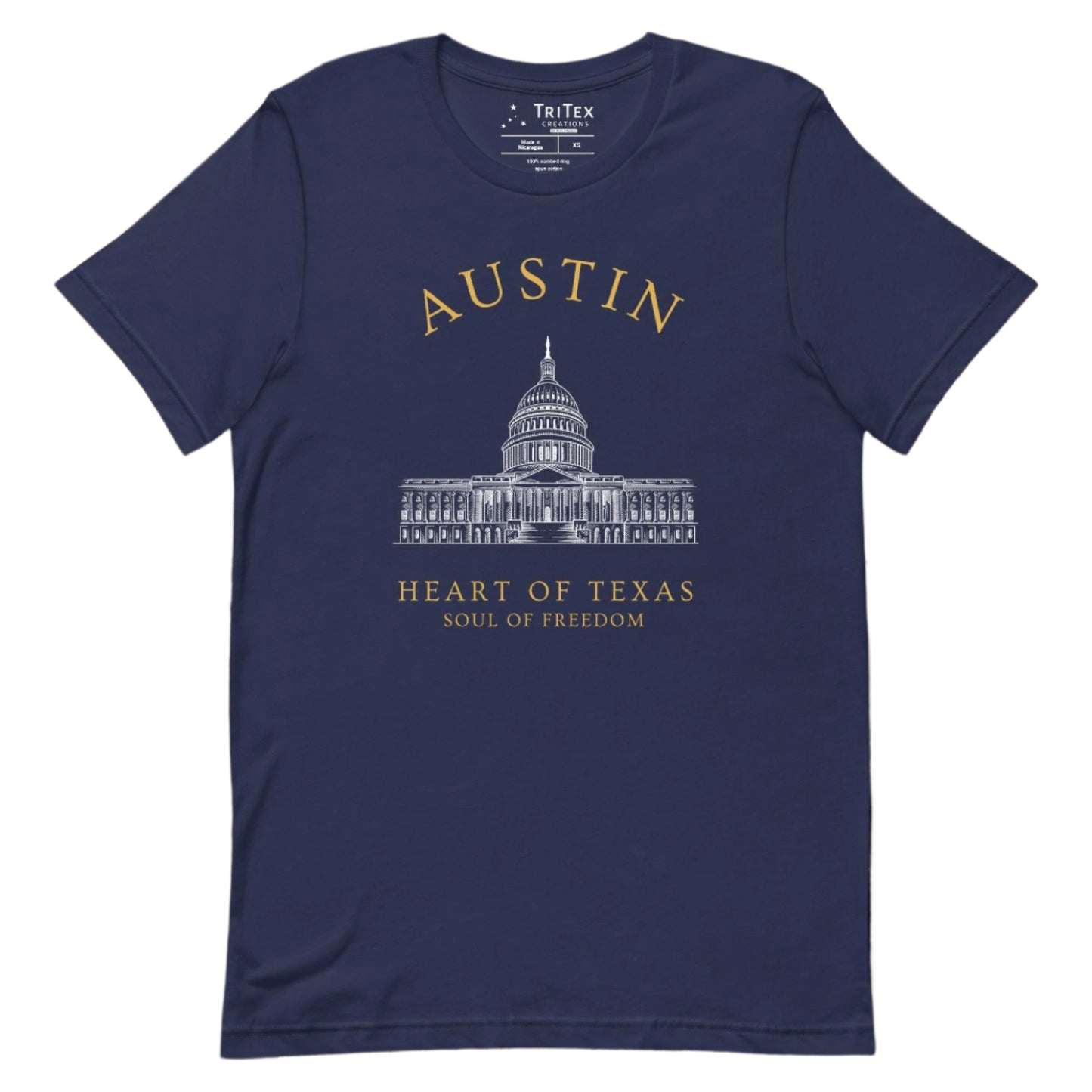 A navy t-shirt featuring the Texas Capitol Building with the text "Austin. Heart of Texas. Soul of Freedom".