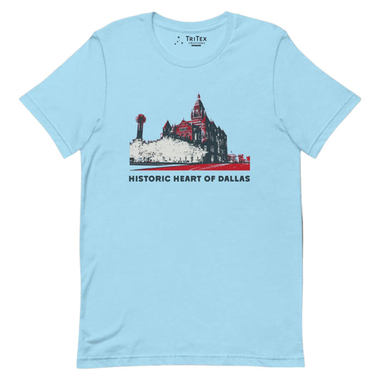 An ocean blue t-shirt picturing the county courthouse and Reunion Tower in Dallas with the text "Historic heart of Dallas".