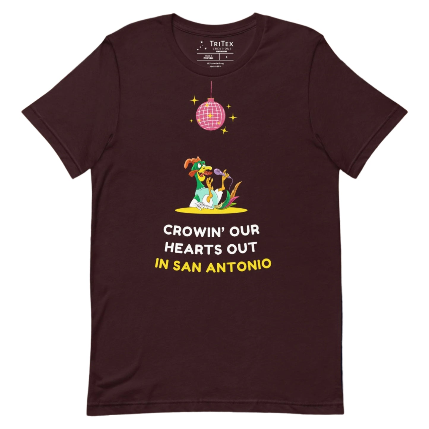 An oxblood black t-shirt featuring a rooster singing it's lungs out under a disco ball above the words "Crowin' our hearts out in San Antonio".