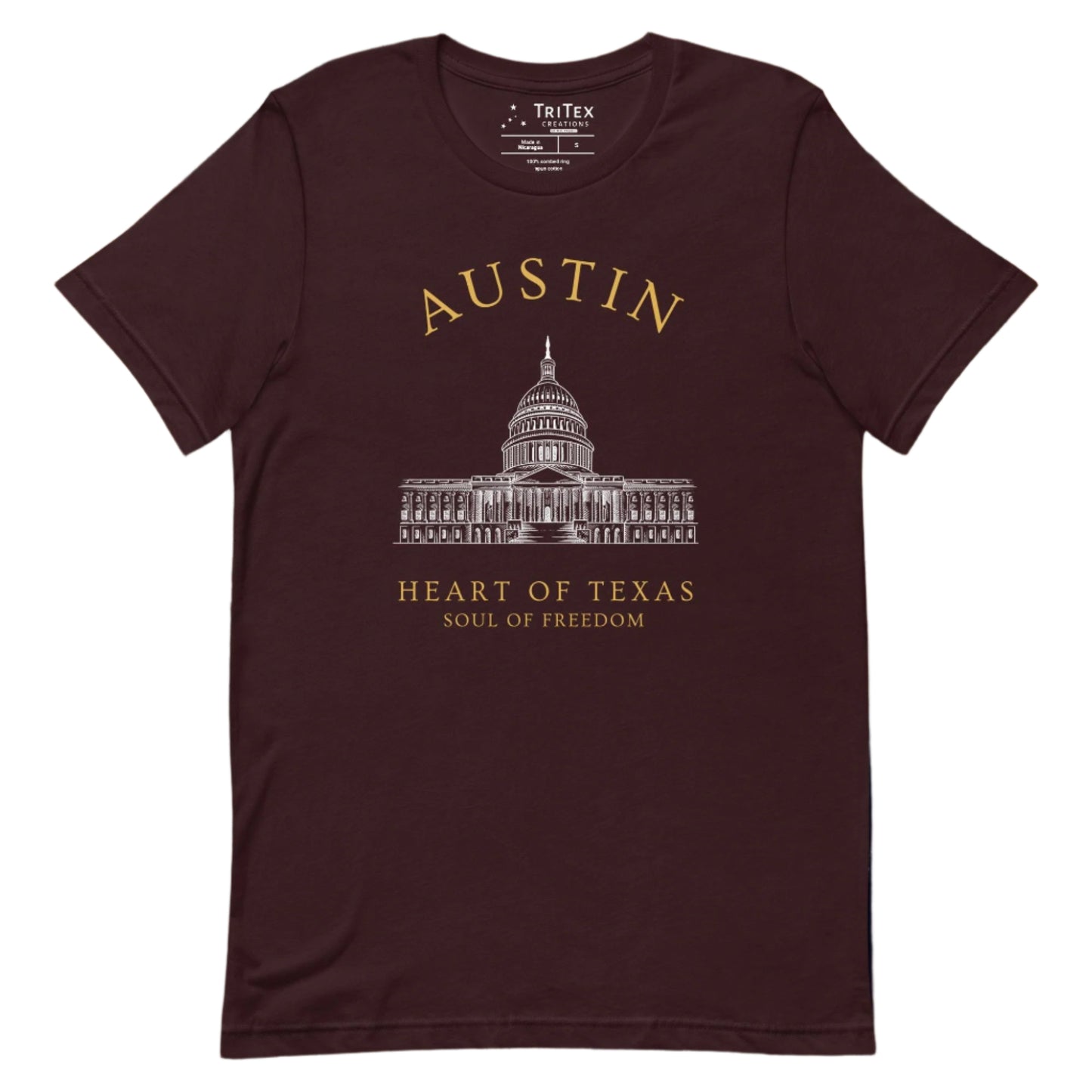 An oxblood black t-shirt featuring the Texas Capitol Building with the text "Austin. Heart of Texas. Soul of Freedom".