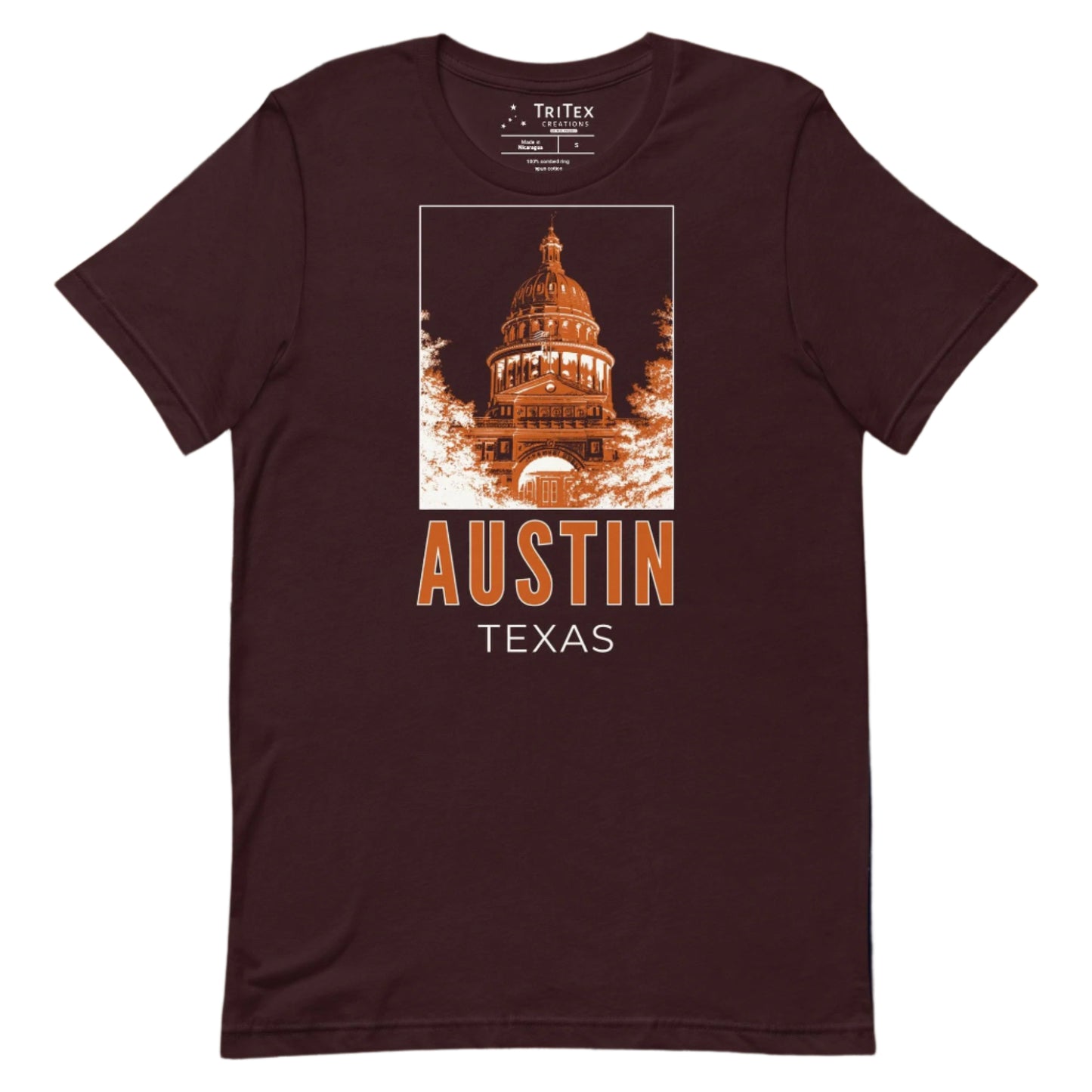 An oxblood black t-shirt featuring an image of the Texas Capitol Building with the words "Austin, Texas" underneath.