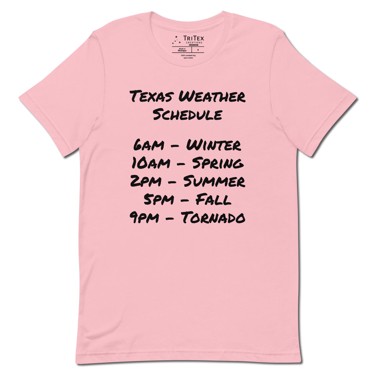 A pink t-shirt with a handwritten list that reads "Texas Weather Schedule. 6AM - Winter. 10AM - Spring. 2PM - Summer. 5PM - Fall. 9PM - Tornado".